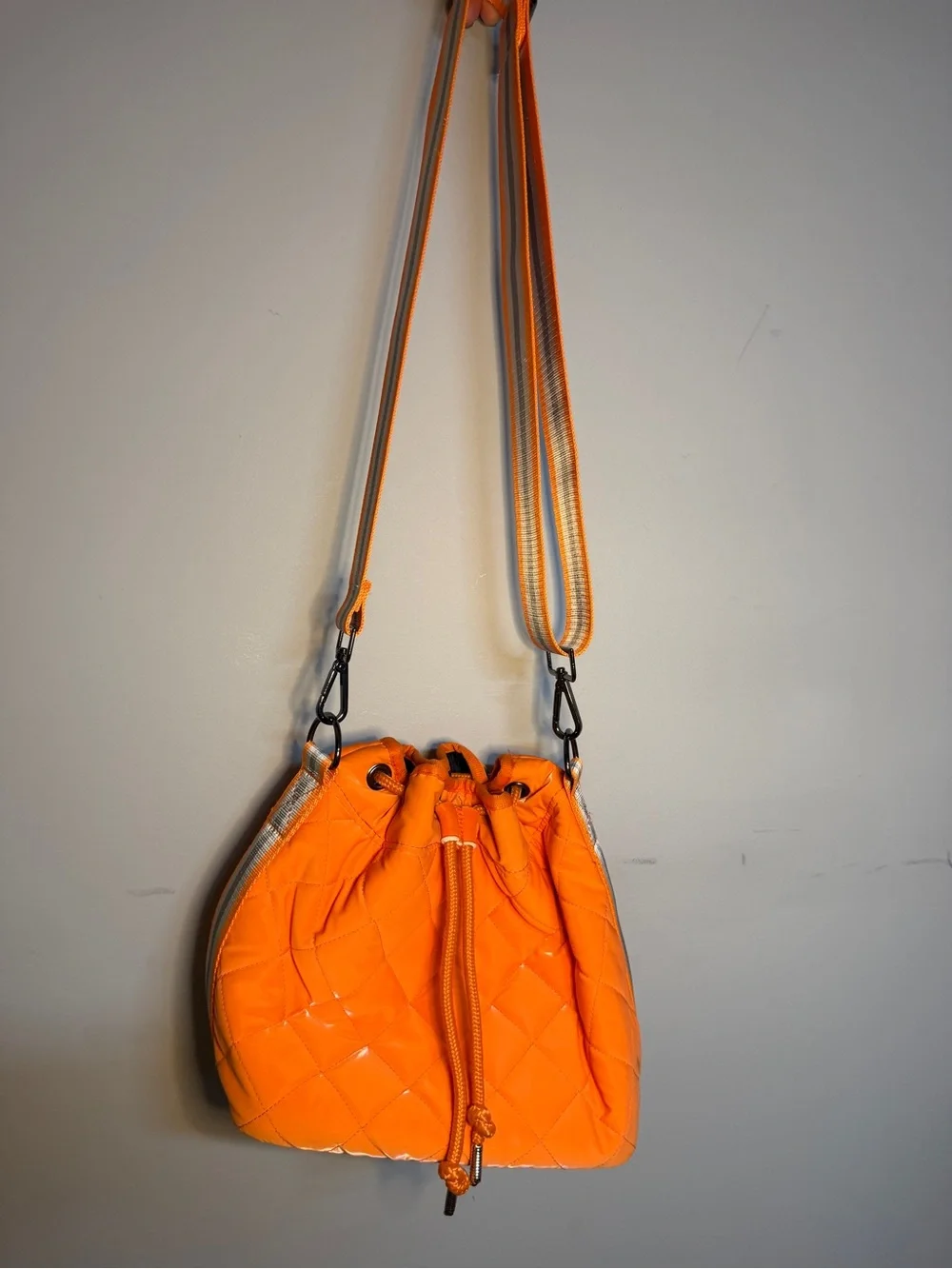 HAUTE SHORE Orange Quilted Crossbody with Striped Strap
